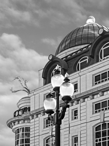 Criterion Building With Three Gold Divers in Black and White