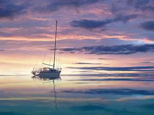 Drifting Yacht At Sunset