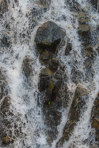 Foamy Cascade Over Rocks
