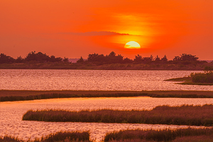 Sun Setting Below Horizon