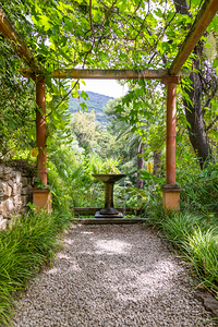 Gazebo perspective with fountain in romantic garden. Green idyll