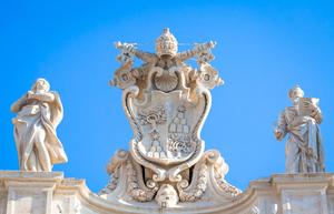 Antique Vatican symbol located in Saint Peter Square Rome Italy