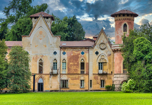ITALY MIRADOLO: gothic design castle located in an Italian garden full of mystery with sunset light.