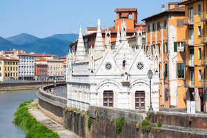 Pisa Italy - colourful buildings on Arno river. Urban skyline 