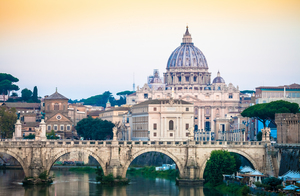 Sunset on Tiber river bridge with Vatican City - Rome Italy