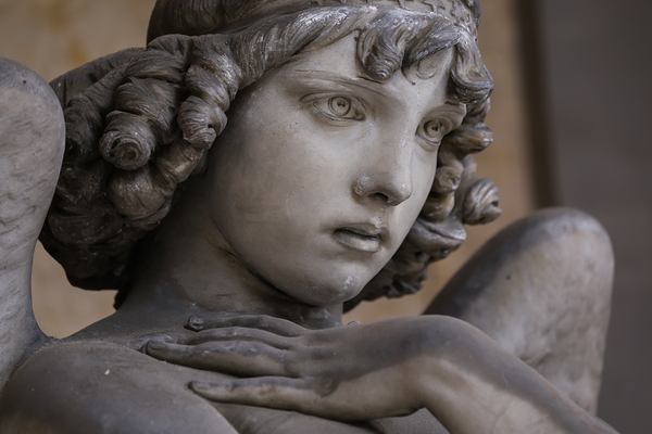 Guardian angel statue in antique cemetery. Print