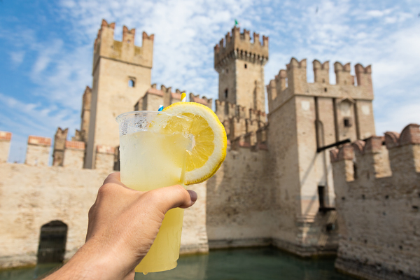 Hand with fresh cold lemonade. Concept for enjoy relaxation tr by Paolo Modena