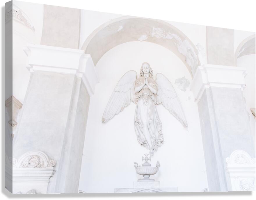 Ancient statue of angel in Italian old cemetery. Religious sculp Canvas Print