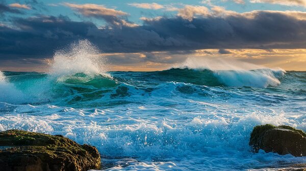 Majestic Ocean Waves Canvas Print - Turquoise Waves Crashing Against Rocks Dramatic Sky & Golden Sunlight - Coastal Wall Art by Zabdou