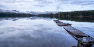 Snow-Kissed Serenity A Dock Amidst the Wonder