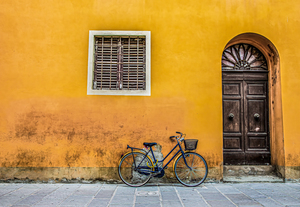 Blue Bike with Yellow Chain on Orange Wall Edit Edit