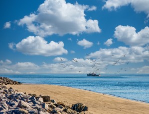 Shrimp Boat Past Rocky Beach Edit Luminar4 edit