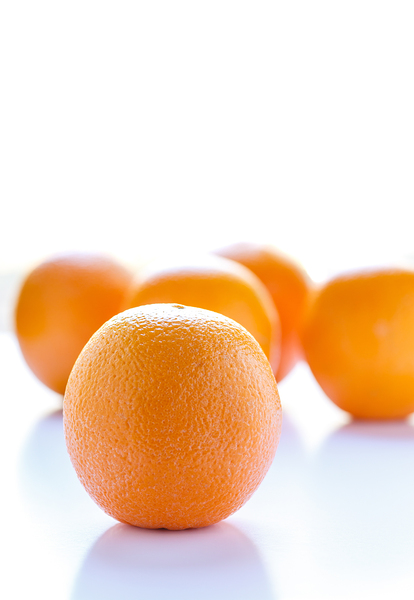 Oranges in Window Light with Copy Space by Darryl Brooks