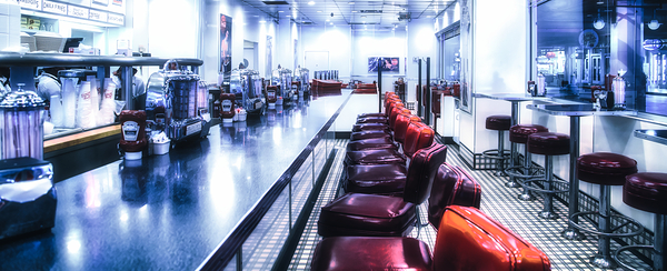 Red Stools and Chrome Counter in a Johnny Rockets Restaurant by Darryl Brooks