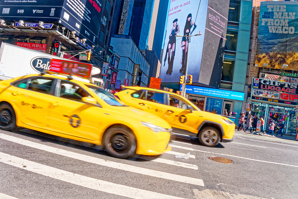 Yellow Cabs Speeding up Broadway by Darryl Brooks