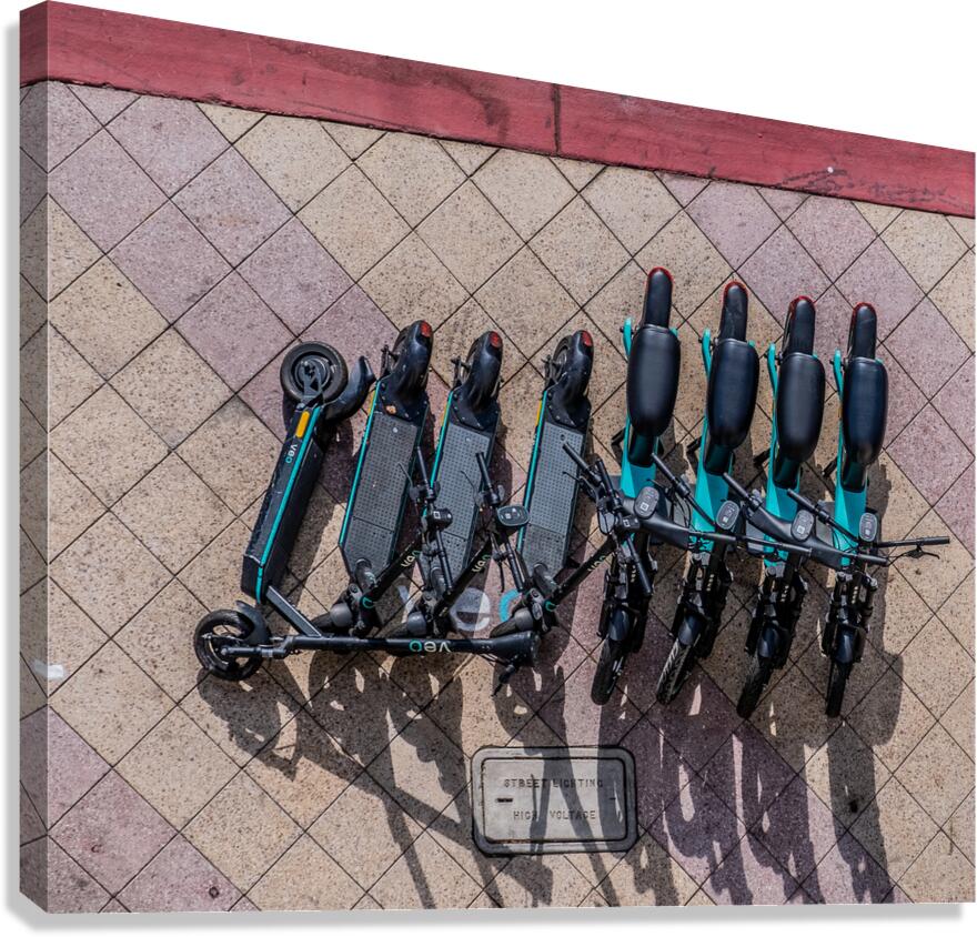 Rental Scooters on Sidewalk from Above Canvas Print