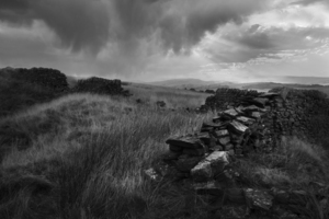 Ancient stone wall on a stormy day - England