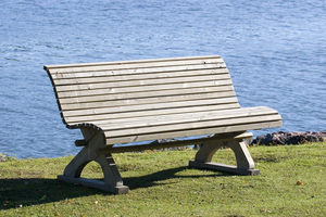 empty wooden bench on shore