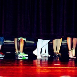 Dancers feet behind curtain 