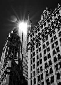 sun reflection off trump tower over wrigley build