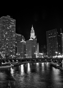 wrigley building and chicago river at night  vert