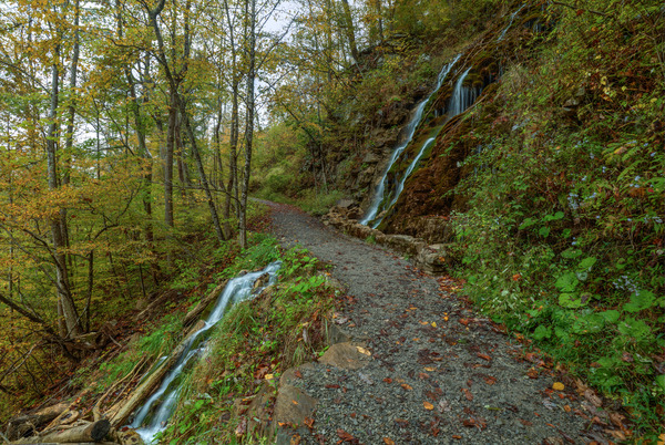 Passing Between Waterfalls Print