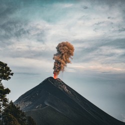 Erupting Volcano Under Cloudy