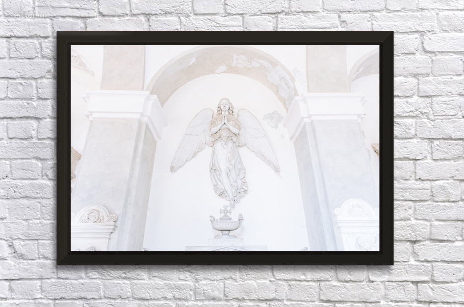 Ancient statue of angel in Italian old cemetery. Religious sculp by Paolo Modena