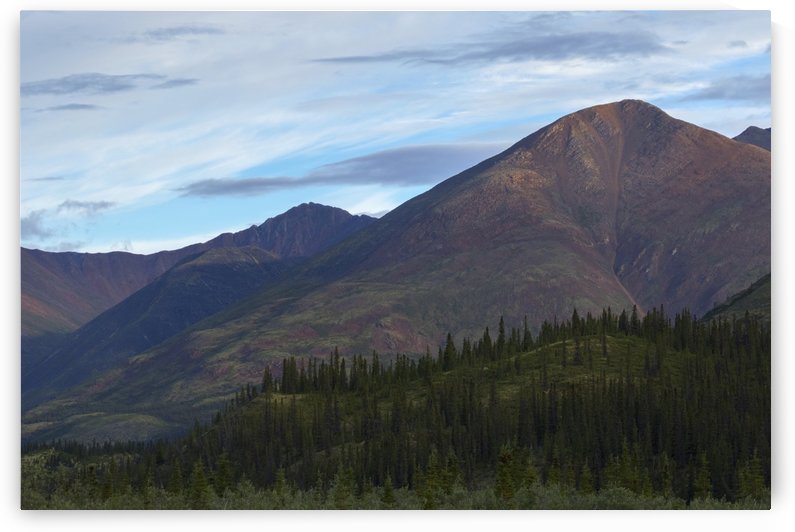 Late afternoon light shining on the mountains along the Wind River in the Peel Watershed; Yukon, Canada by PacificStock