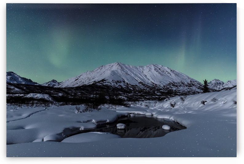 Aurora Borealis (Northern Lights) dance above Idaho Peak and the Little Susitna River at Hatcher Pass in winter, South-central Alaska; Alaska, United States of America by PacificStock