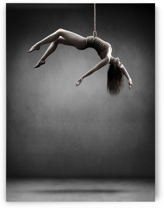 Woman hanging on a rope by Johan Swanepoel