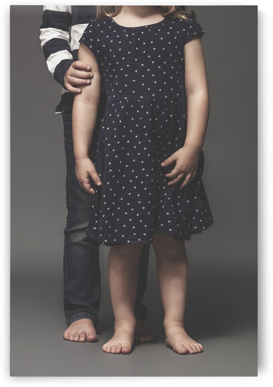 portrait of sibling children barefoot by Gualtiero Boffi