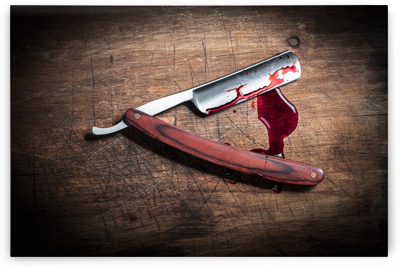 Bloody razor on wood by Gualtiero Boffi