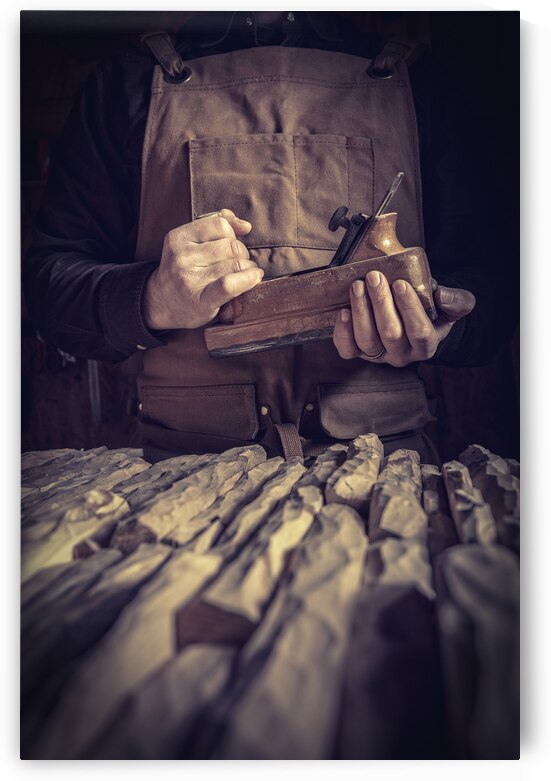 carpenter holding a planer by Gualtiero Boffi