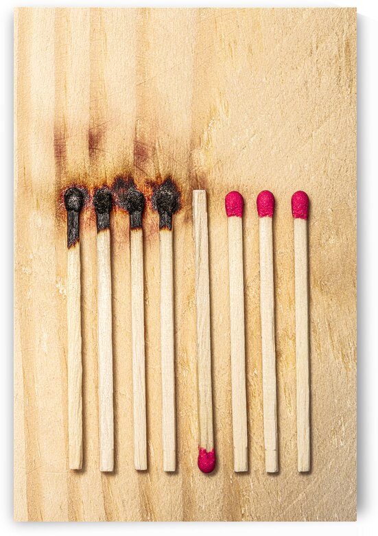 matches in a row some of which were lit and burnt by Gualtiero Boffi