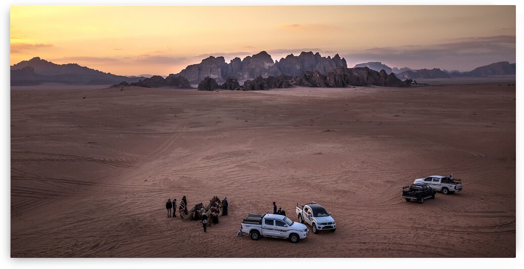 tourists in the wadi rum desert at sunset by Gualtiero Boffi