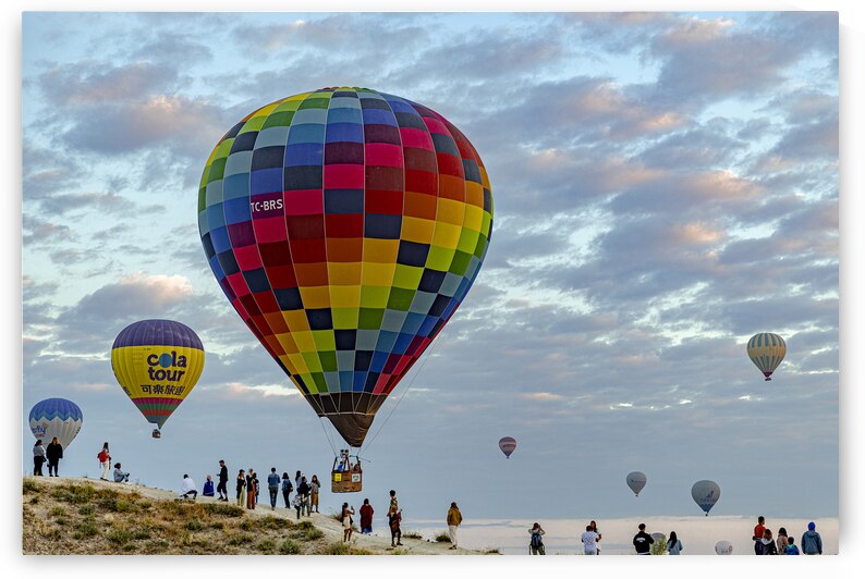hot air balloons fly over the skies of cappadocia at dawn by Gualtiero Boffi