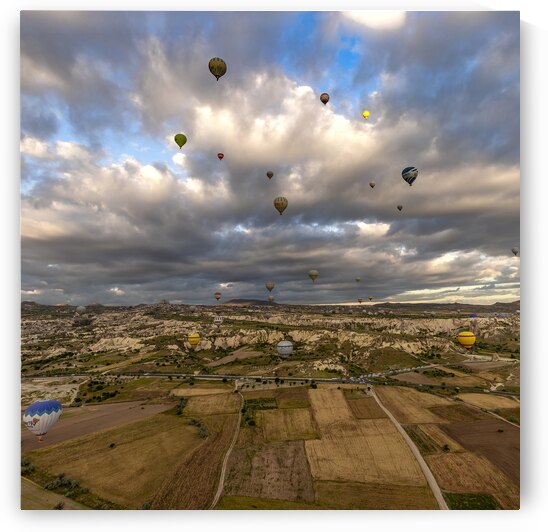 colorful hot air balloons fly at sunrise near goreme by Gualtiero Boffi