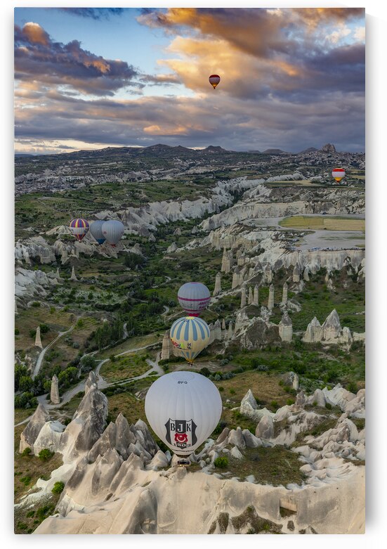 colorful hot air balloons fly at sunrise near goreme vie from b by Gualtiero Boffi