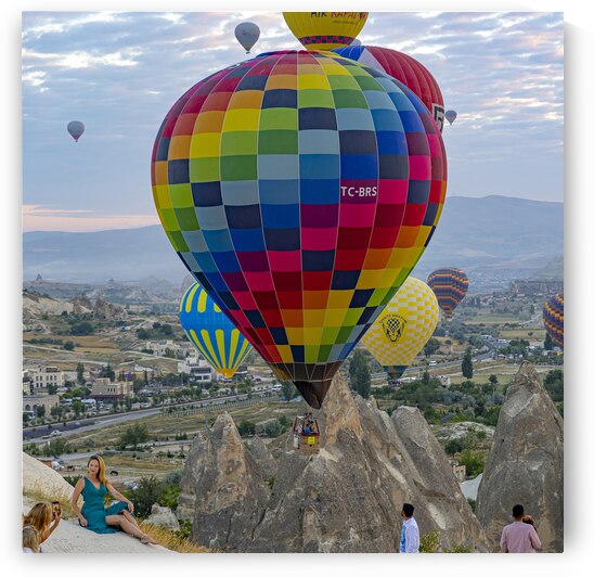 tourists take pictures with hot air balloons in the background by Gualtiero Boffi