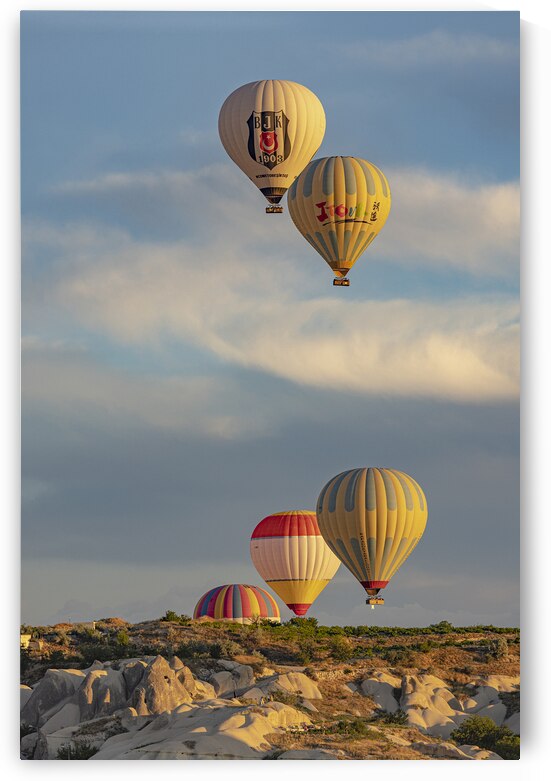 hot air balloons fly over goreme  by Gualtiero Boffi