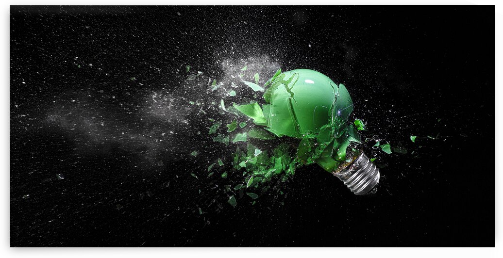 green electric light bulb exploding by Gualtiero Boffi