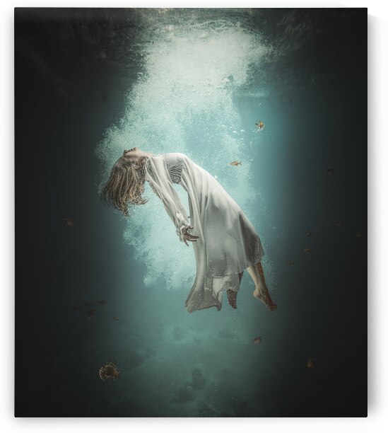 Caucasian woman with long white dress floats underwater  by Gualtiero Boffi