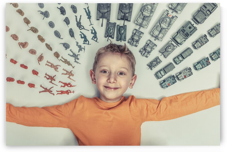 happy child with toys by Gualtiero Boffi