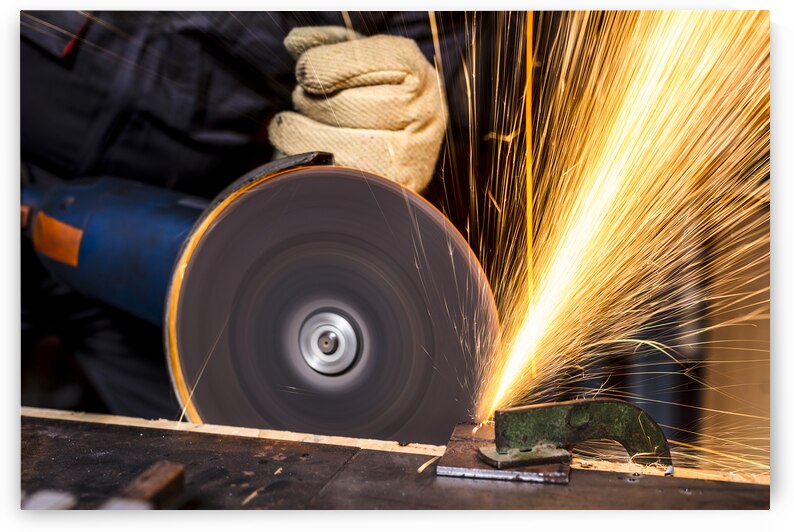 man with grinder in action by Gualtiero Boffi