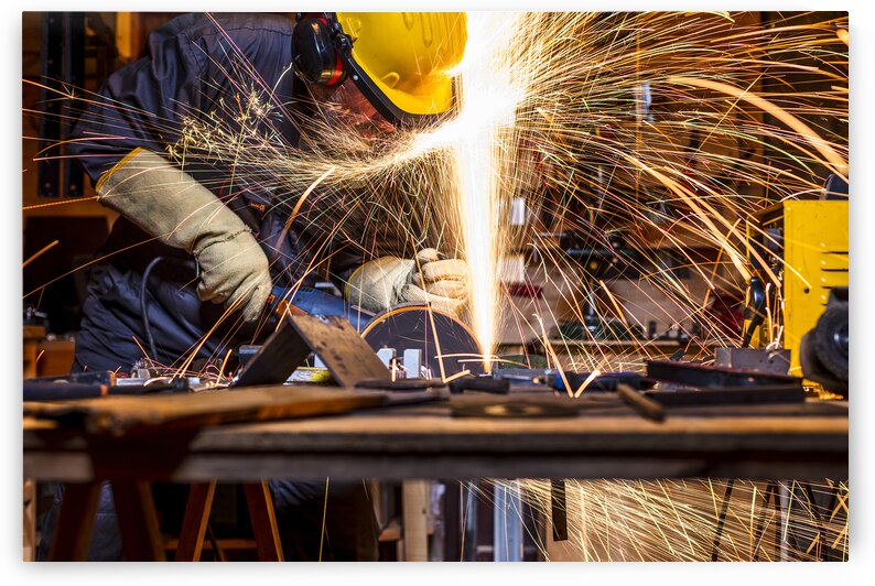 man with grinder in action by Gualtiero Boffi