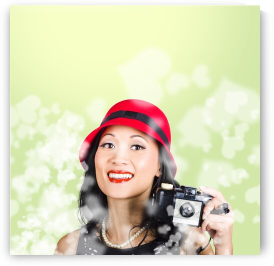 Woman taking photographs with vintage camera by Jorgo