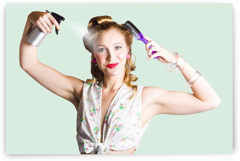 Isolated woman styling her hair on white by Jorgo