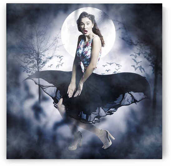 Scared young woman in eerie halloween forest  by Jorgo