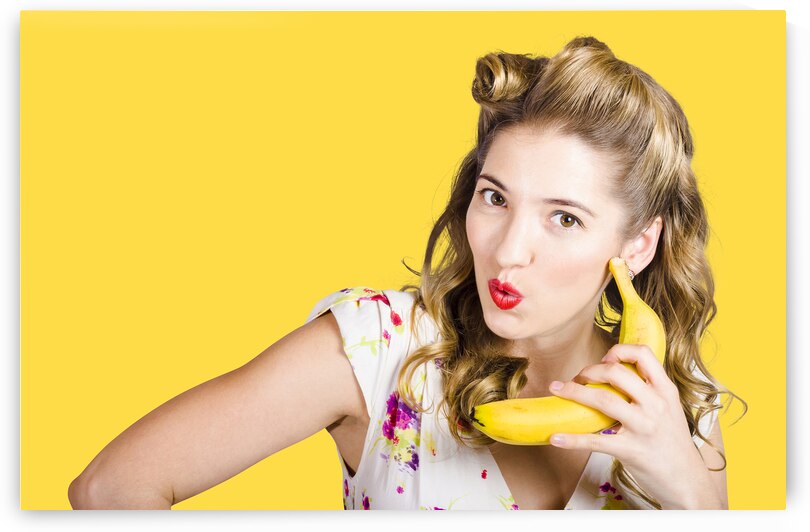 Pinup woman ordering organic fruit on banana phone by Jorgo